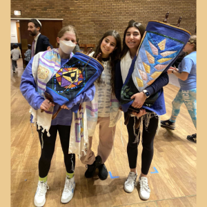 Three young ladies with Torahs